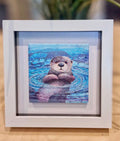 Framed Glass otter tile