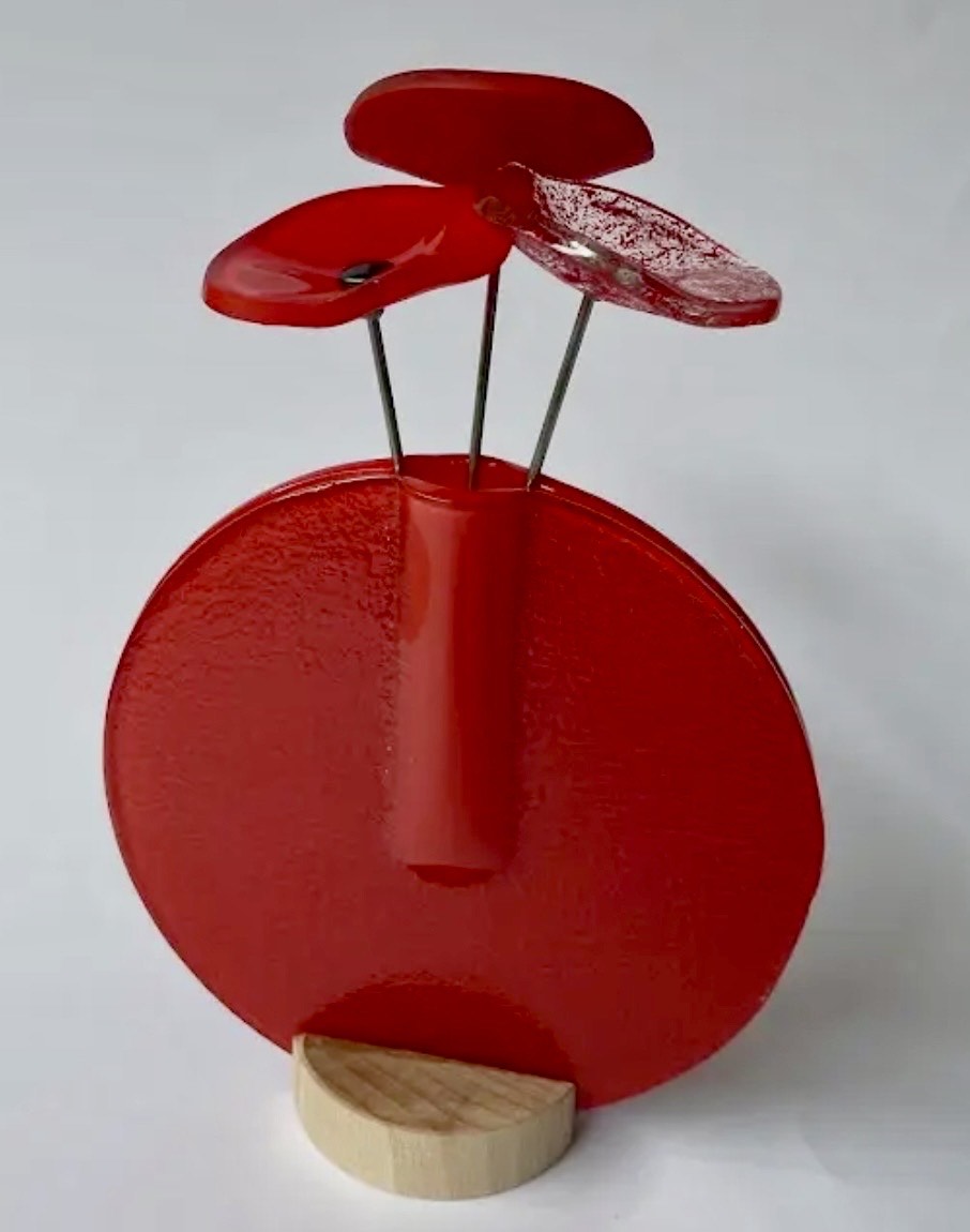 Modern glass flowers in vase in multiple colours