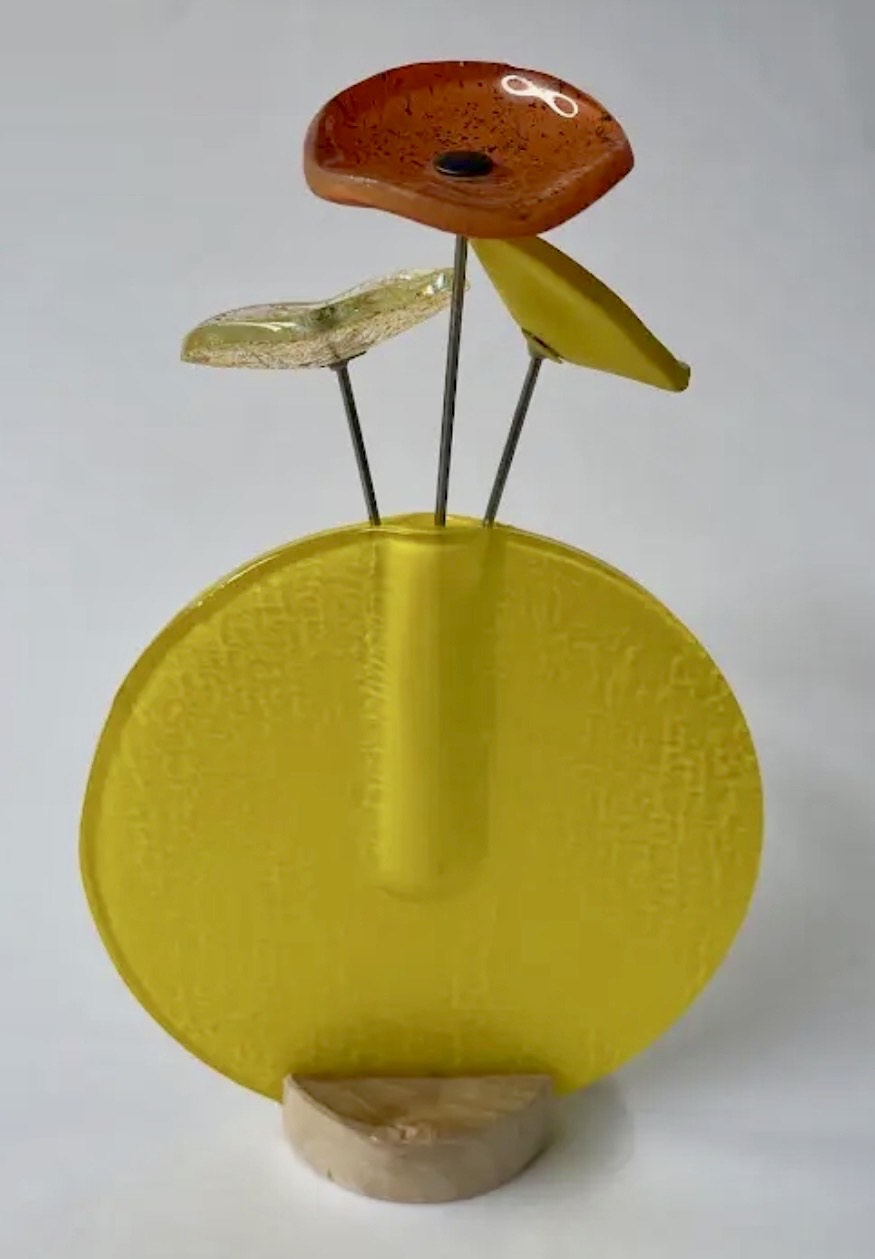 Modern glass flowers in vase in multiple colours