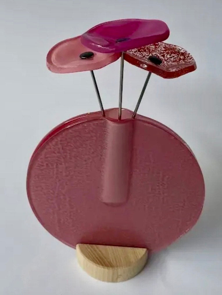 Modern glass flowers in vase in multiple colours