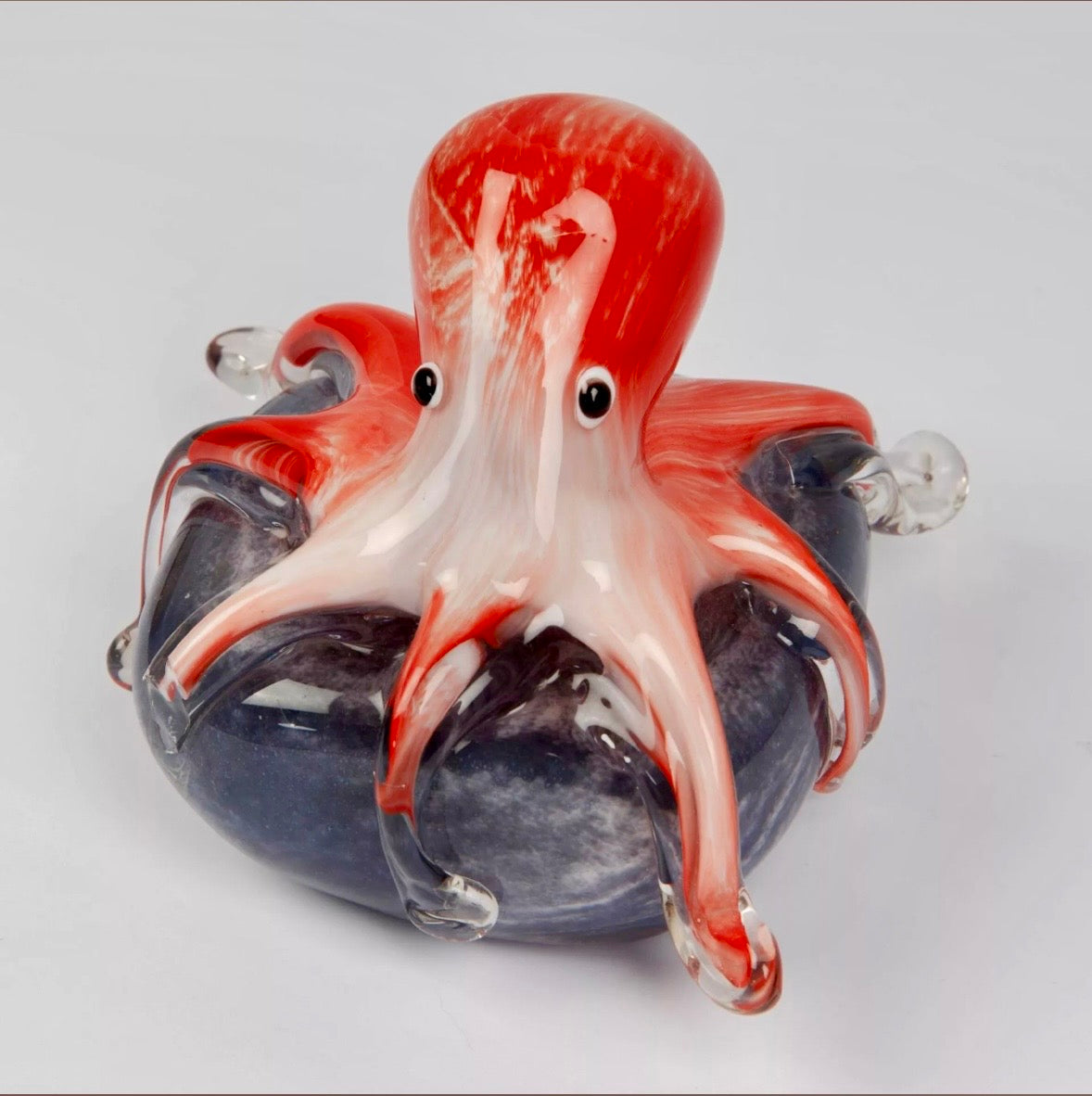 Pink glass Octopus on beach stone