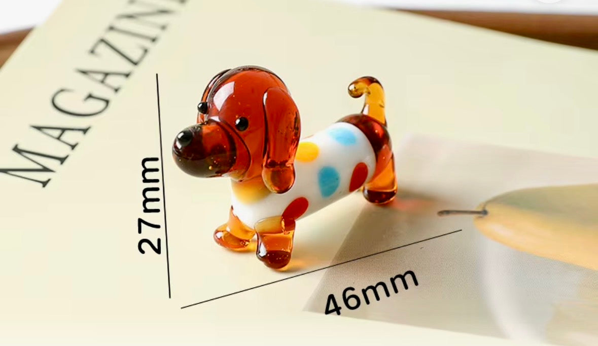Glass Dachshund dog wearing a polka dot coat